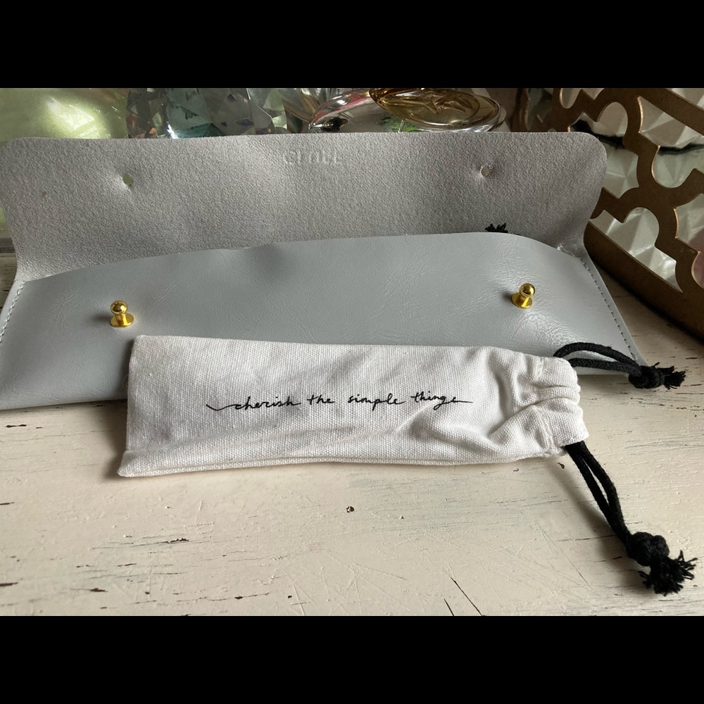 Black leather watch strap with gold clasp